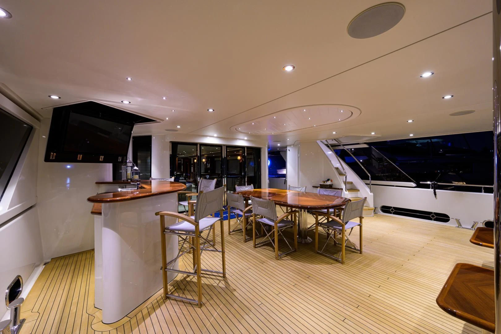 a room with tables and chairs aboard LADY JJ Yacht for Charter