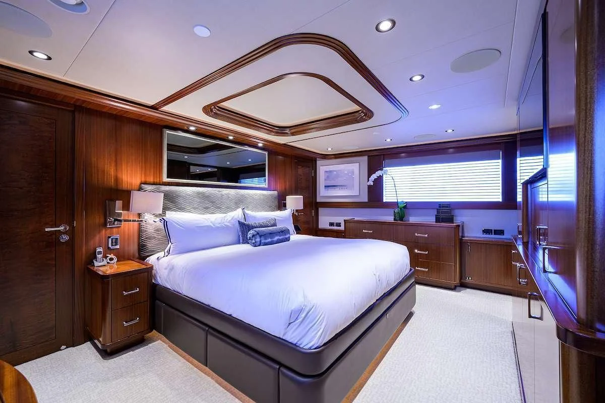 a bedroom with a large bed aboard LADY JJ Yacht for Charter