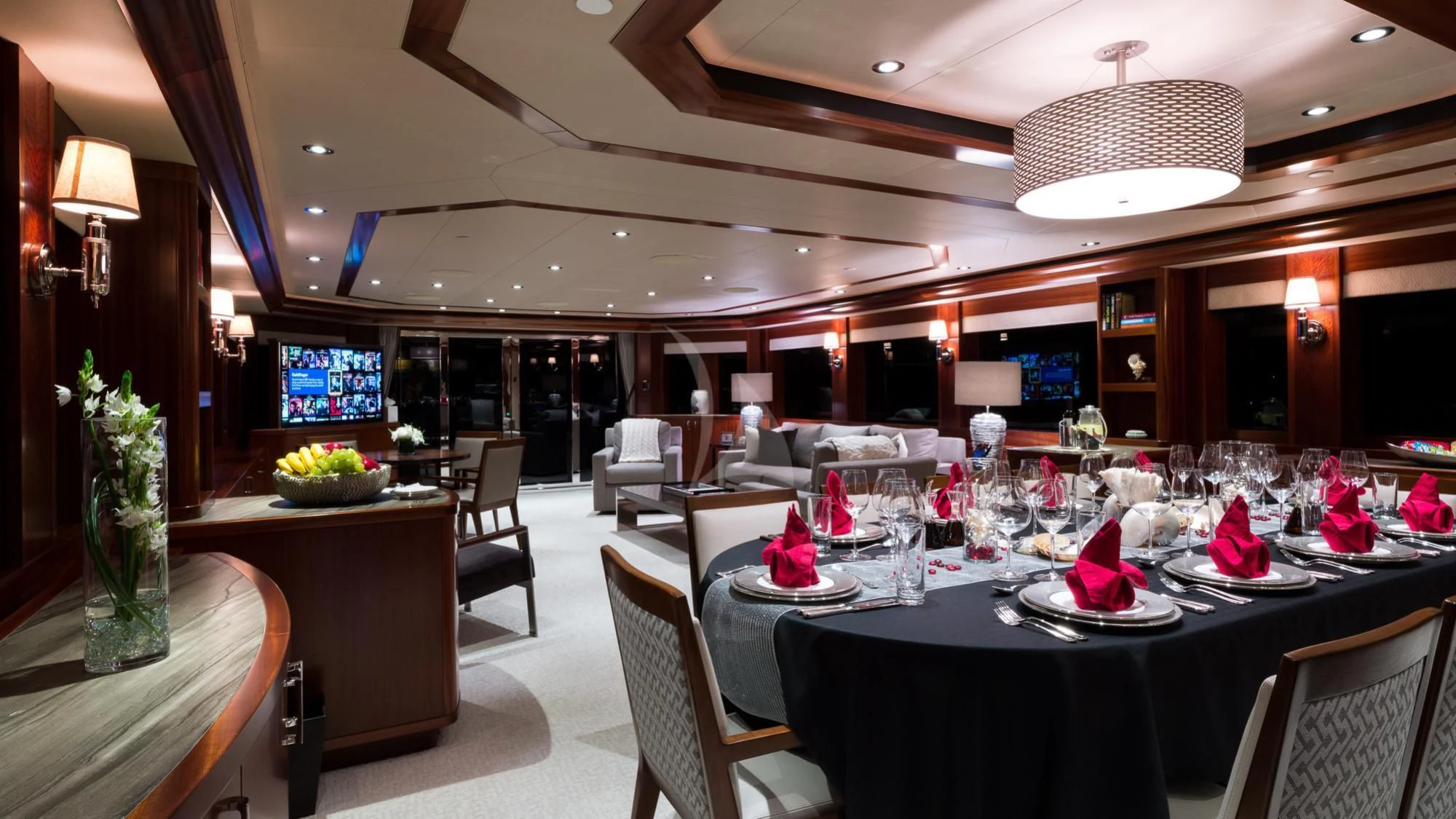 a room with tables and chairs aboard LADY JJ Yacht for Charter
