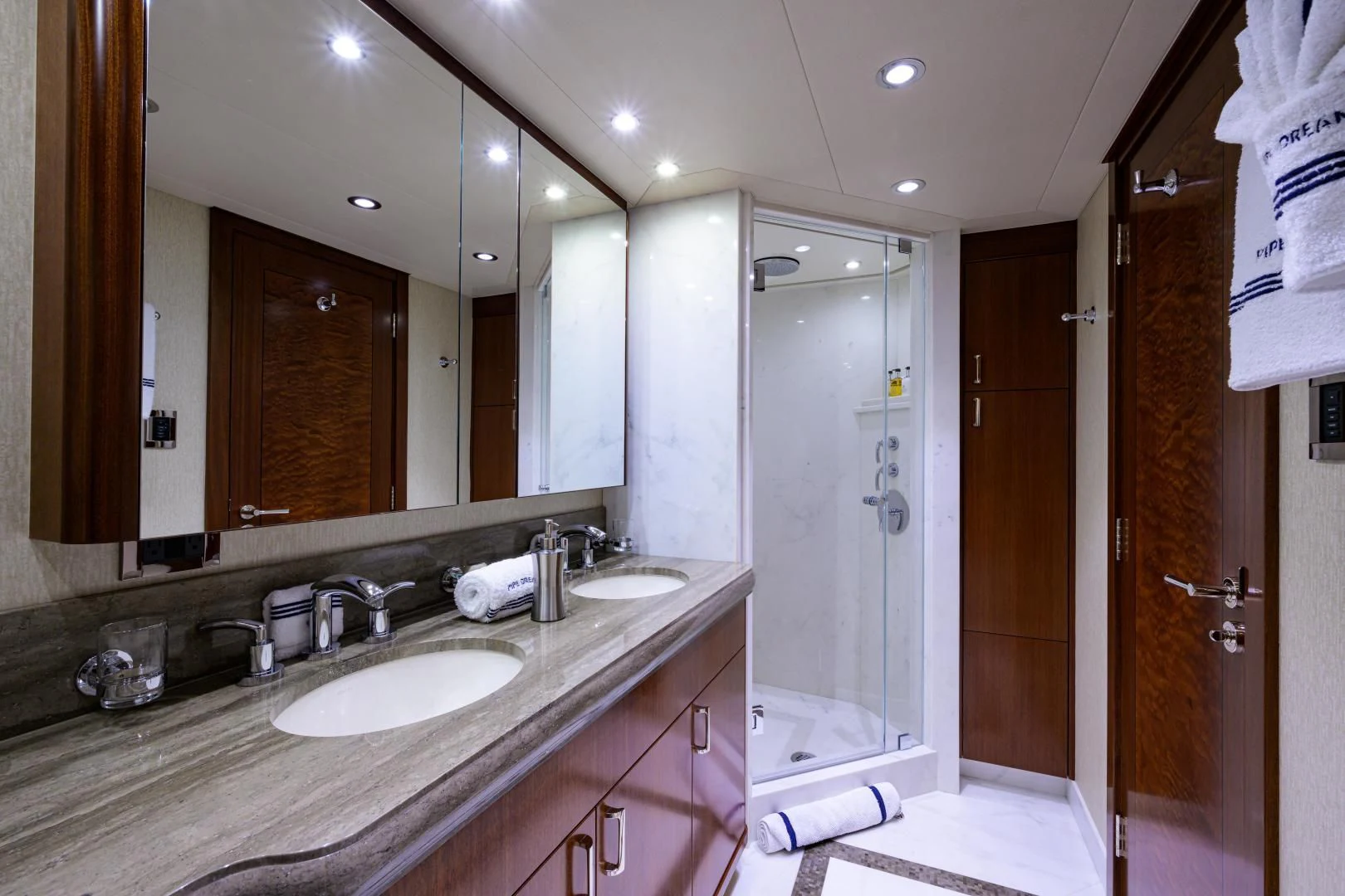 a bathroom with a large mirror aboard LADY JJ Yacht for Charter
