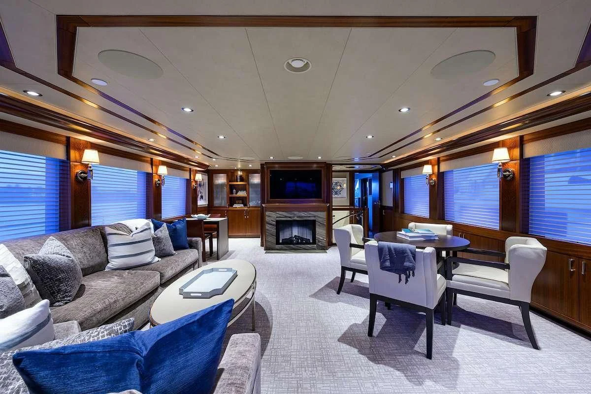 a living room with a fireplace aboard LADY JJ Yacht for Charter
