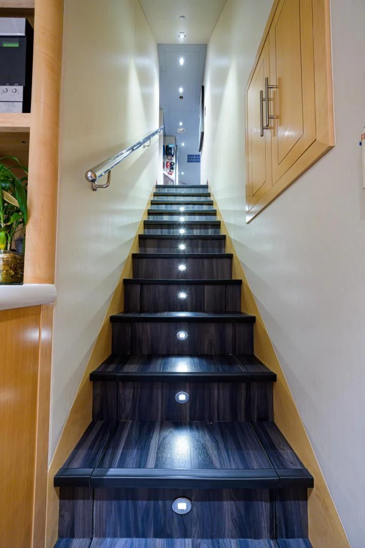 a black staircase in a house aboard LADY JJ Yacht for Charter