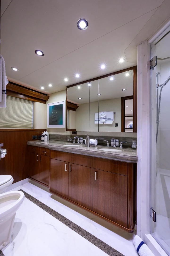 a bathroom with a large mirror aboard LADY JJ Yacht for Charter