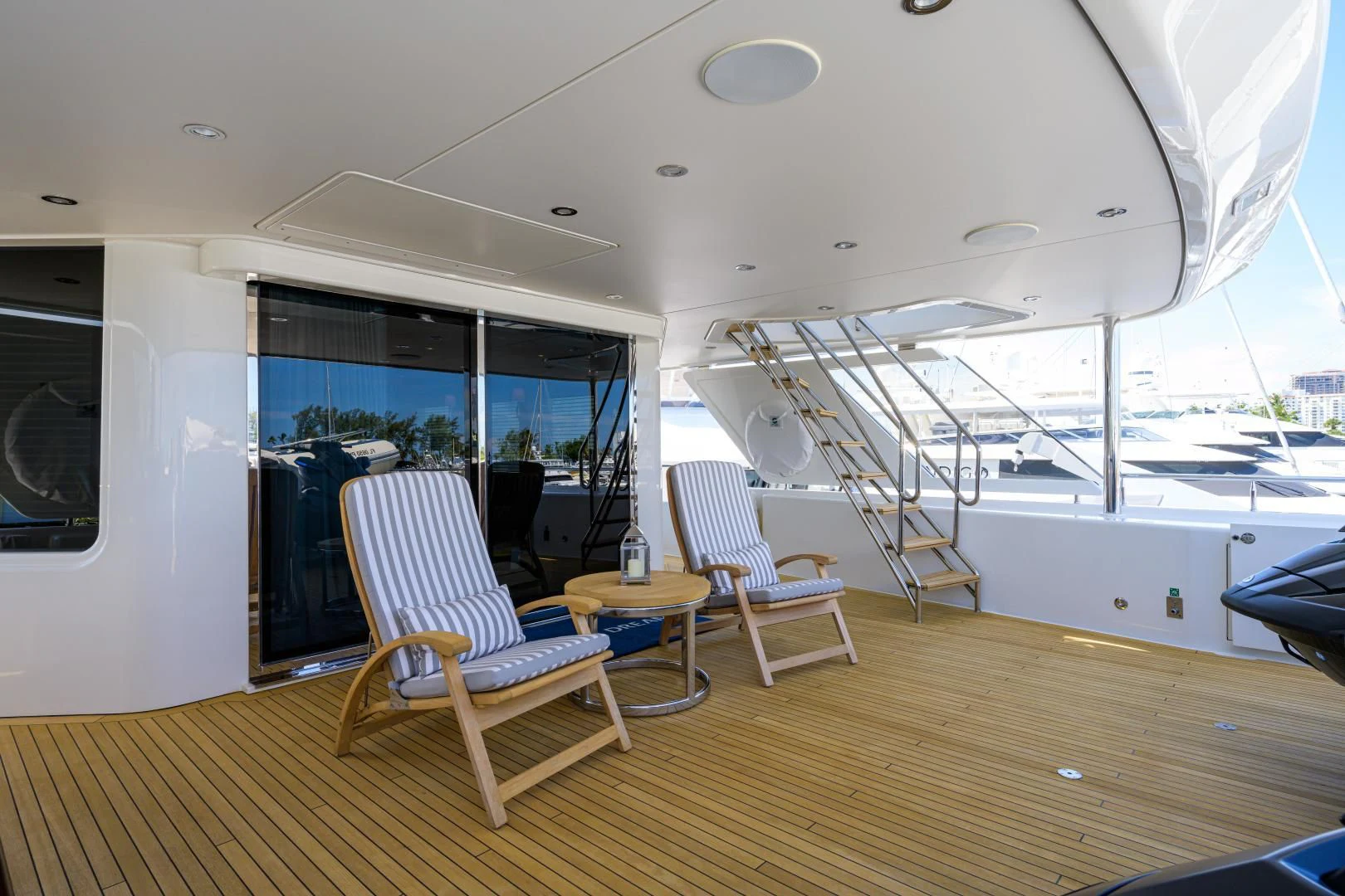 a room with a table chairs and a large window aboard LADY JJ Yacht for Charter