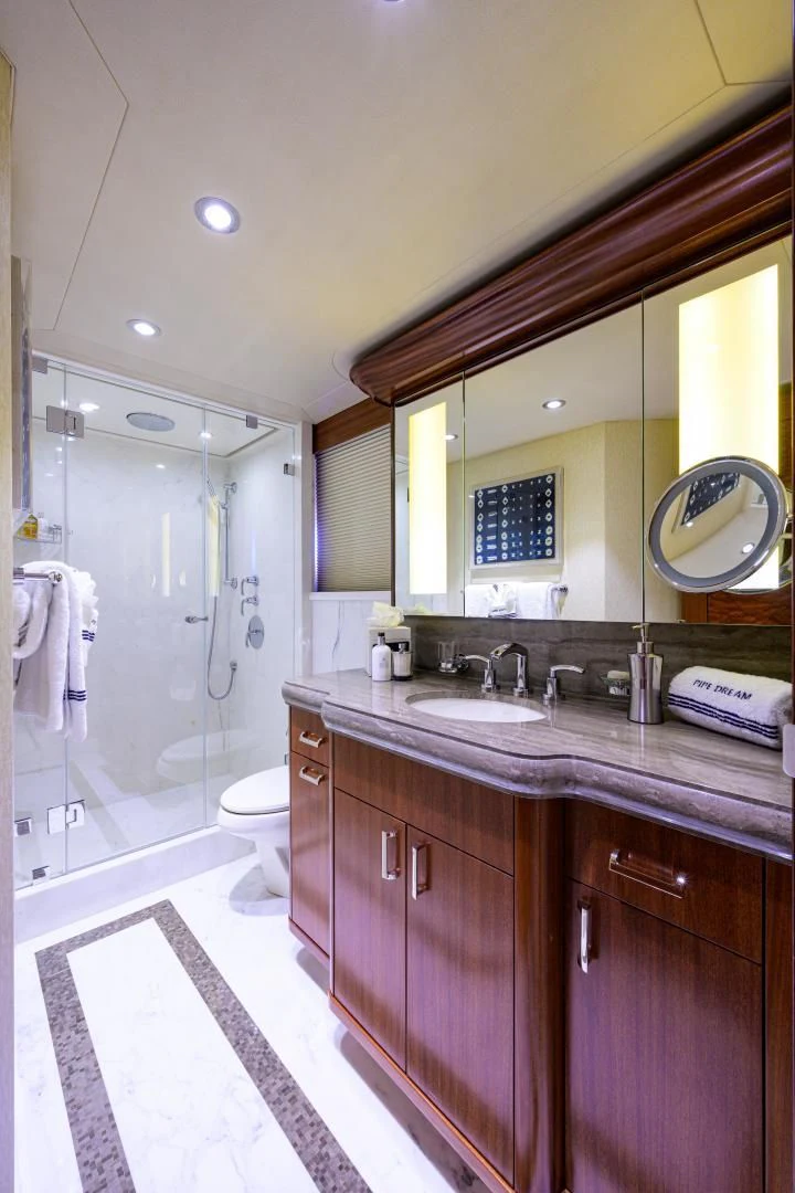a bathroom with a sink and a shower aboard LADY JJ Yacht for Charter