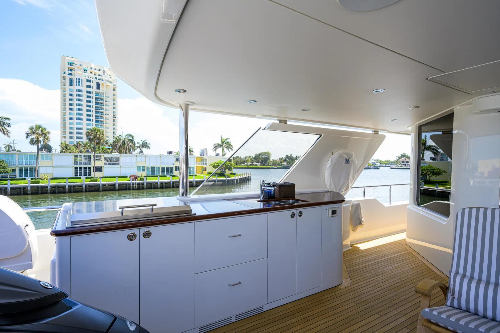 a large white room with a large balcony and a pool aboard LADY JJ Yacht for Charter