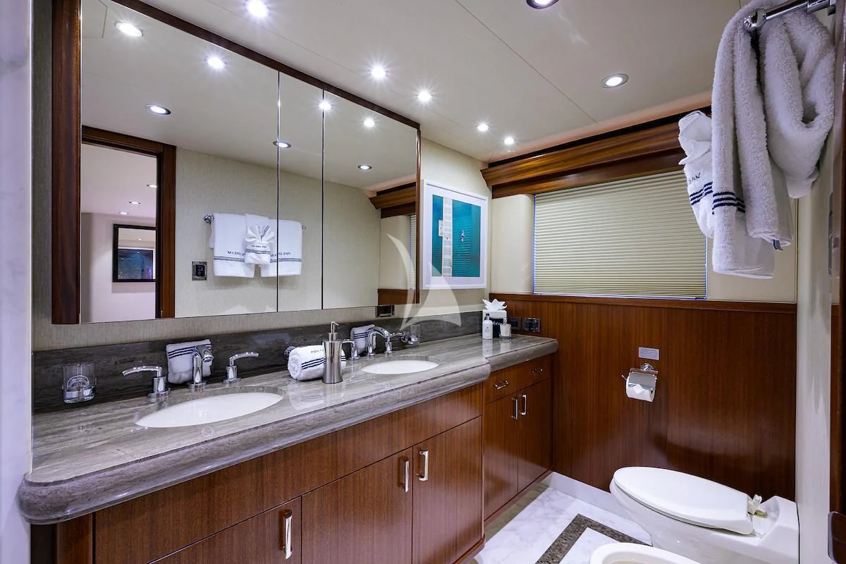 a bathroom with a large mirror aboard LADY JJ Yacht for Charter