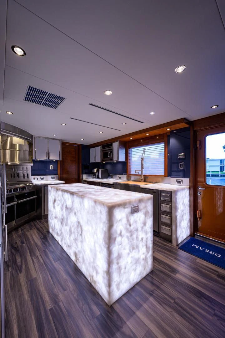 a large kitchen with a large island aboard LADY JJ Yacht for Charter