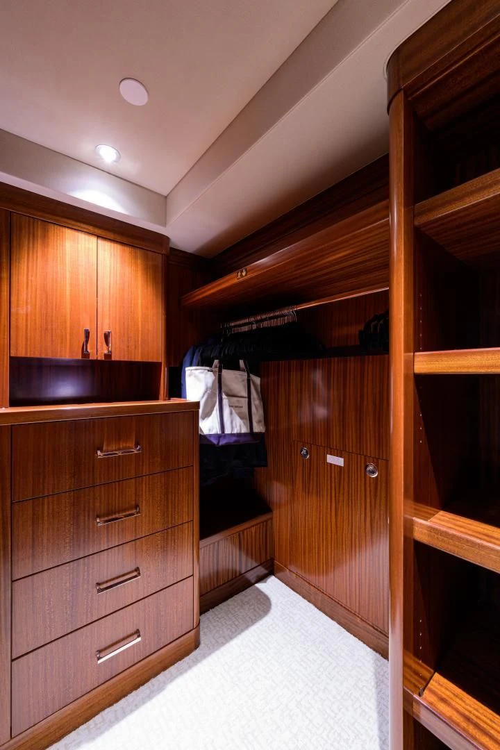 a wooden closet with a white towel from it aboard LADY JJ Yacht for Charter