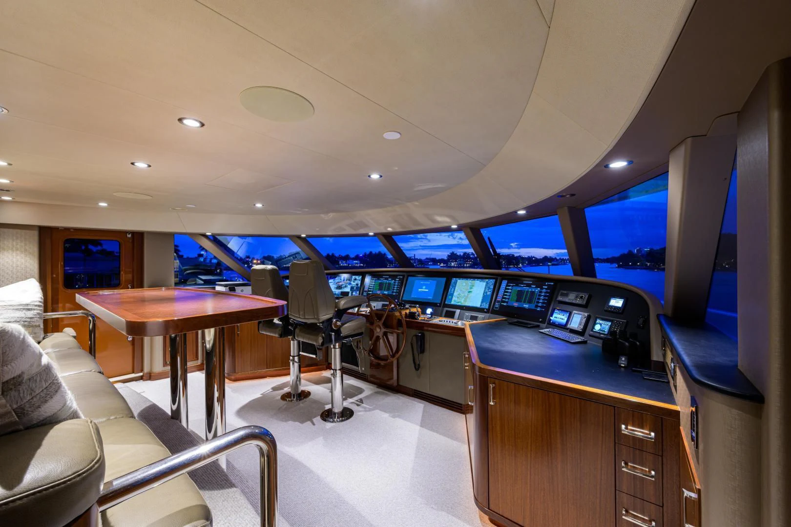 a room with a desk and chairs aboard LADY JJ Yacht for Charter