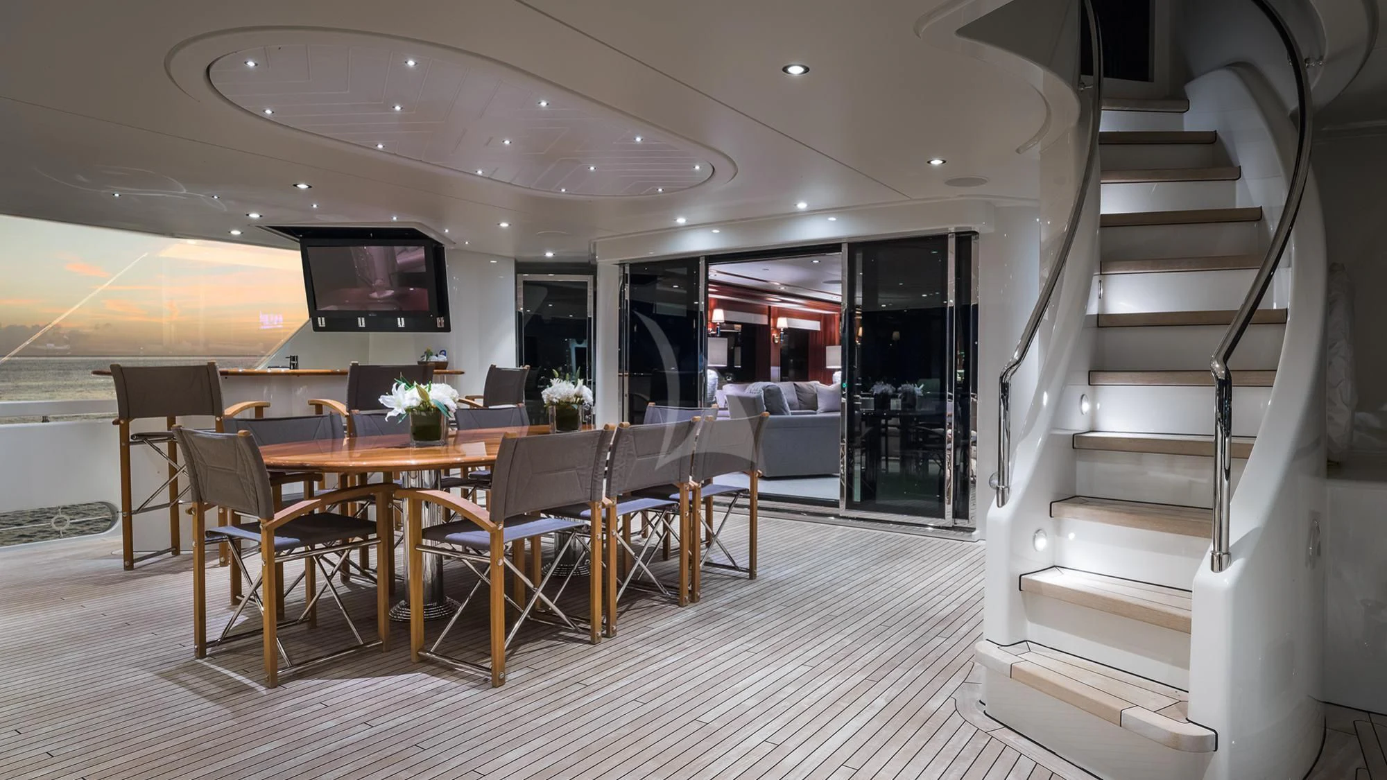 a large room with a table and chairs aboard LADY JJ Yacht for Charter