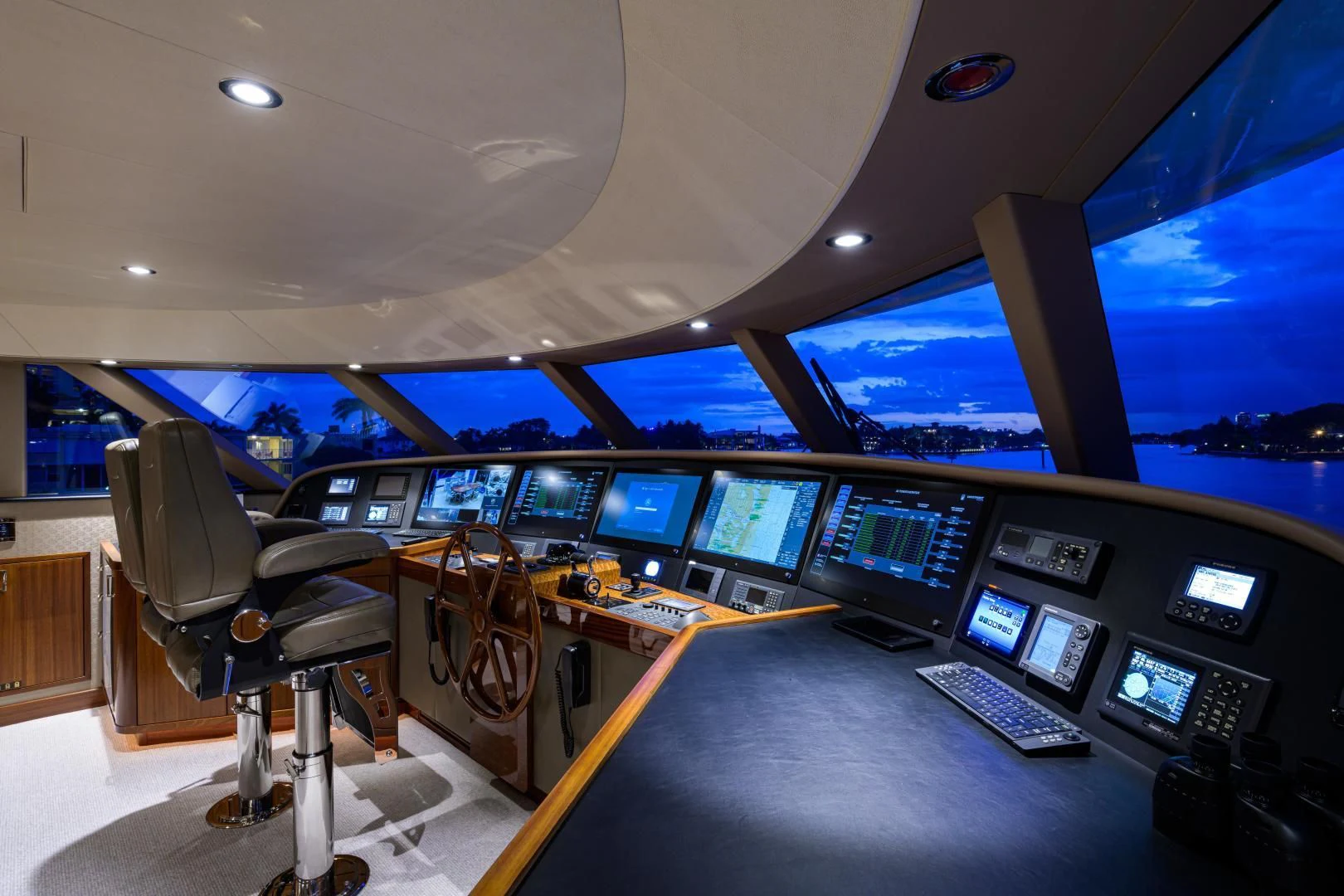 an airplane cockpit with many monitors aboard LADY JJ Yacht for Charter