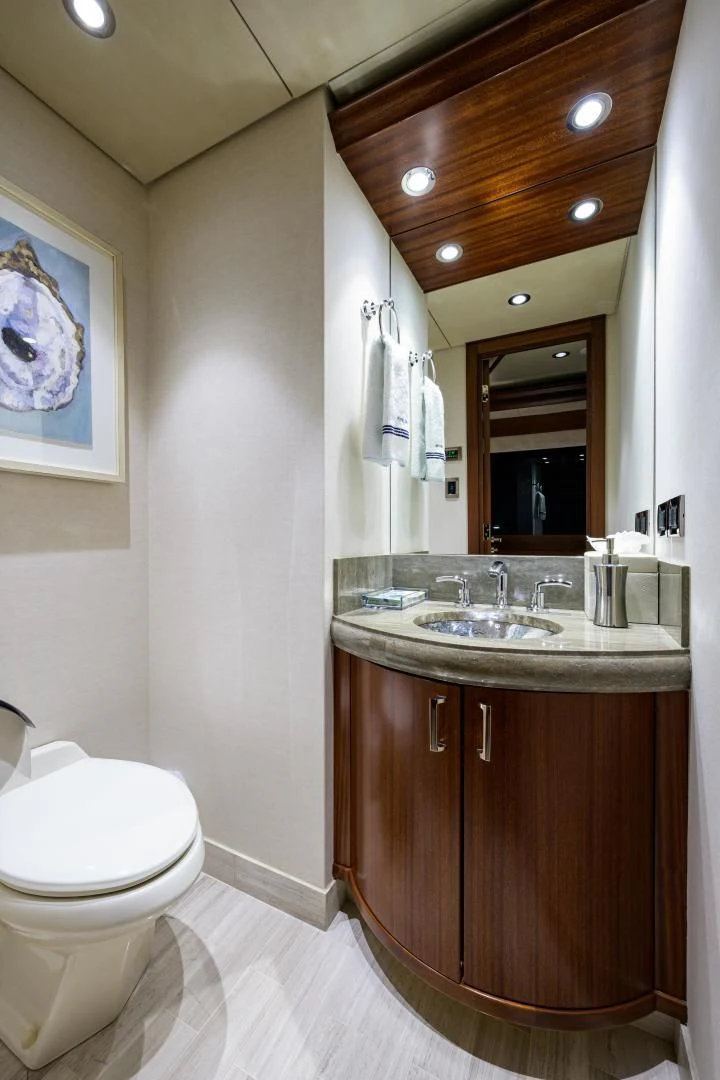 a bathroom with a sink and a toilet aboard LADY JJ Yacht for Charter