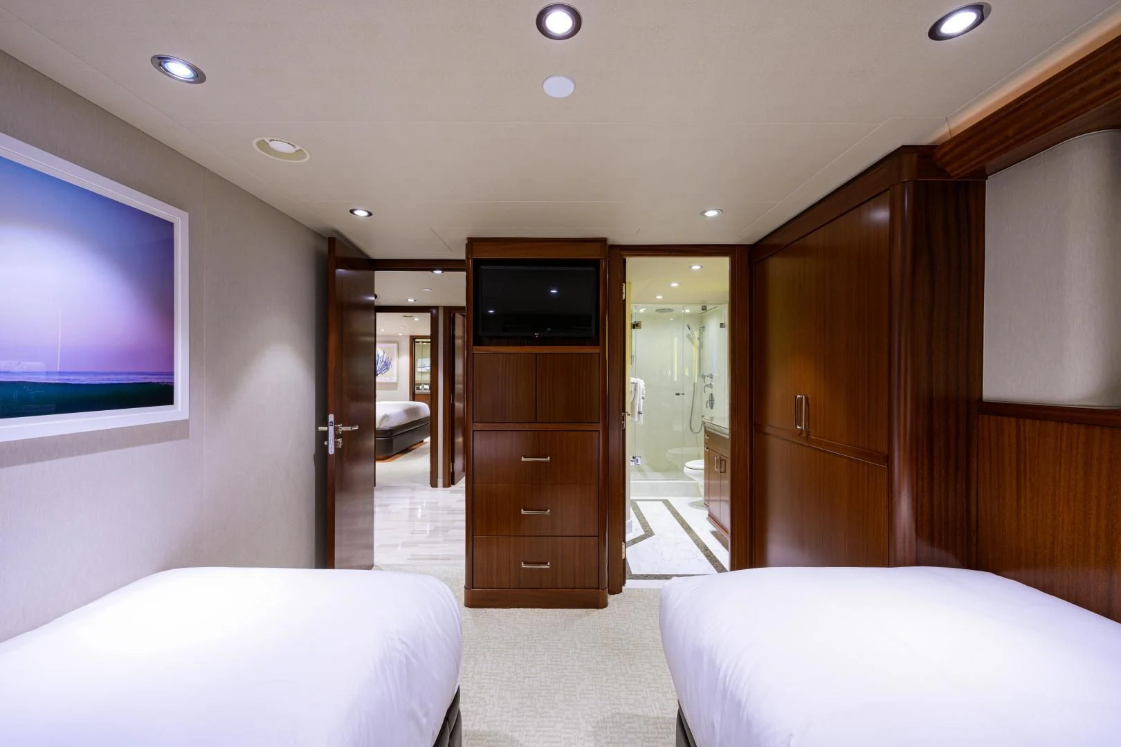 a room with a bed and a television aboard LADY JJ Yacht for Charter