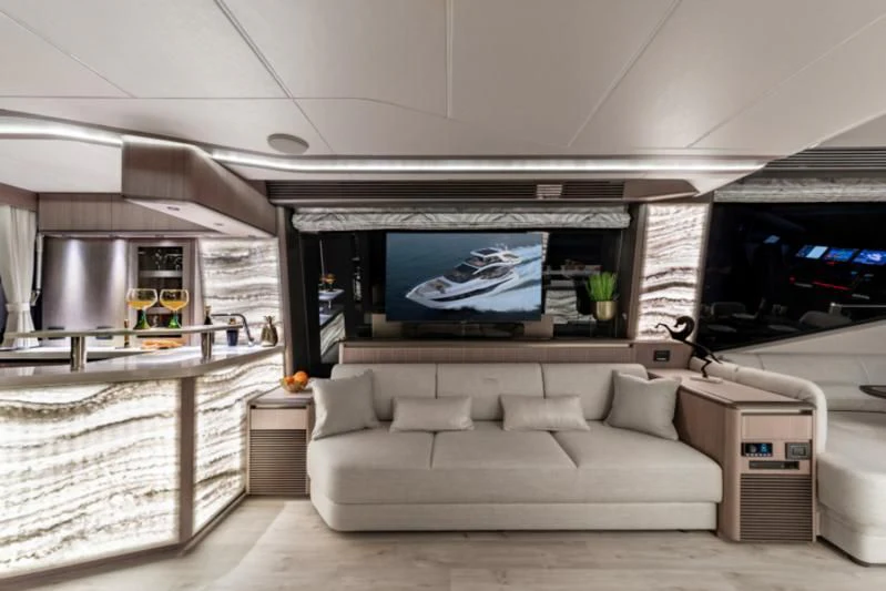 a living room with a large screen aboard GALEON 800 FLY/1 Yacht for Sale