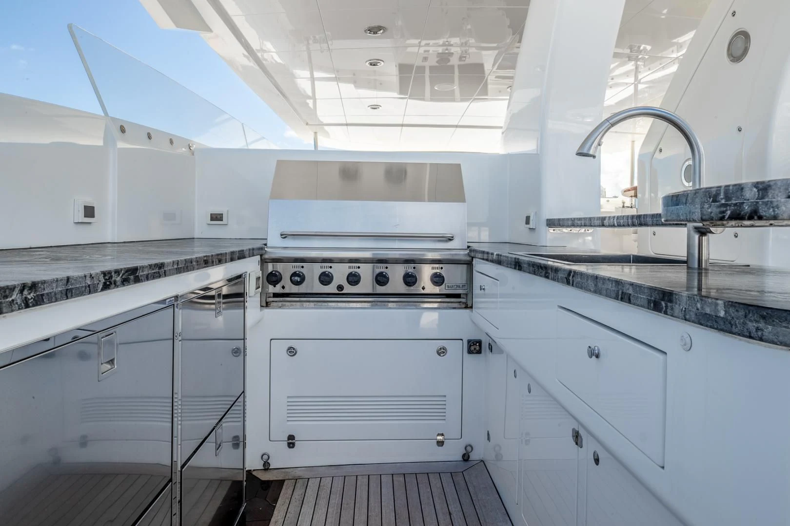 a kitchen with white cabinets aboard FUGITIVE *NAME RESERVED* Yacht for Sale
