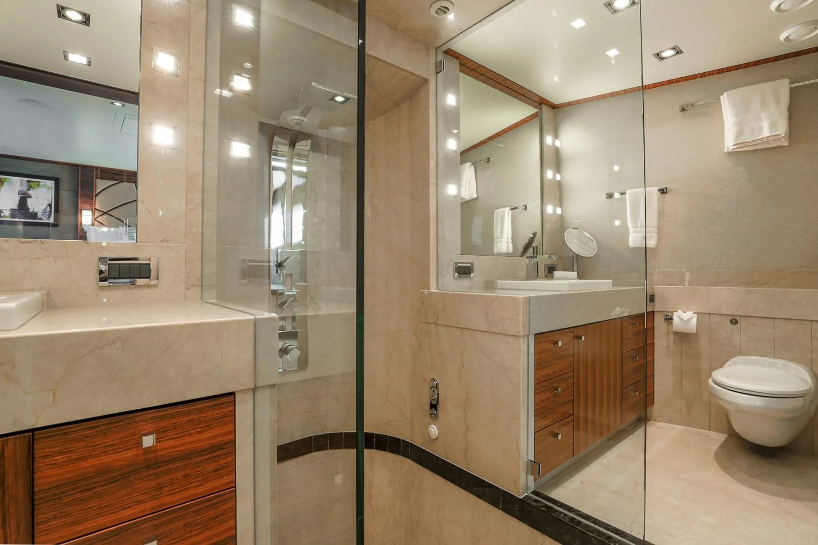 a bathroom with a glass shower aboard FUGITIVE *NAME RESERVED* Yacht for Sale