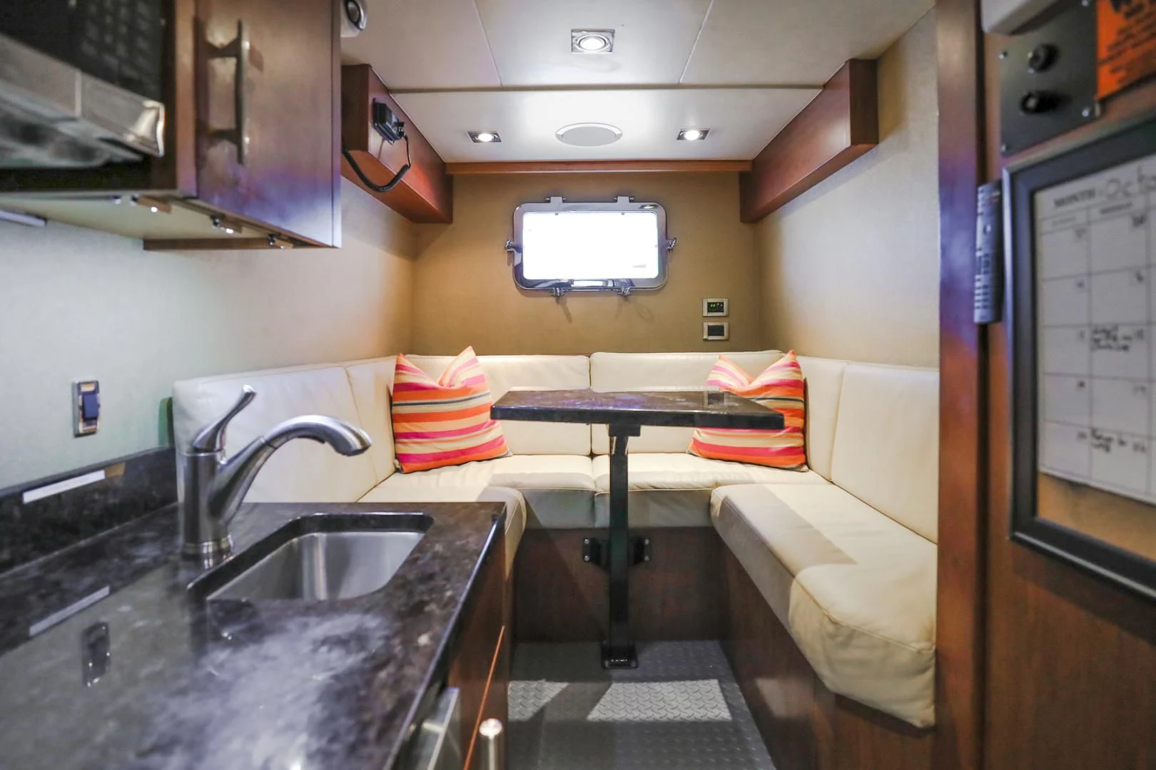 a kitchen with a sink and a bed aboard FUGITIVE *NAME RESERVED* Yacht for Sale