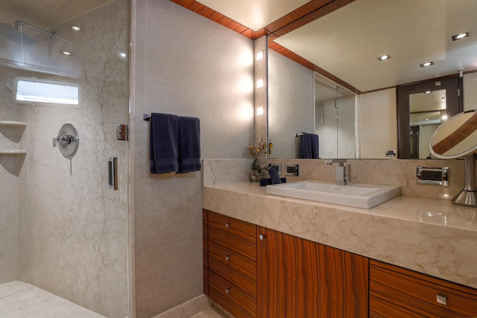 a bathroom with a large mirror aboard FUGITIVE *NAME RESERVED* Yacht for Sale