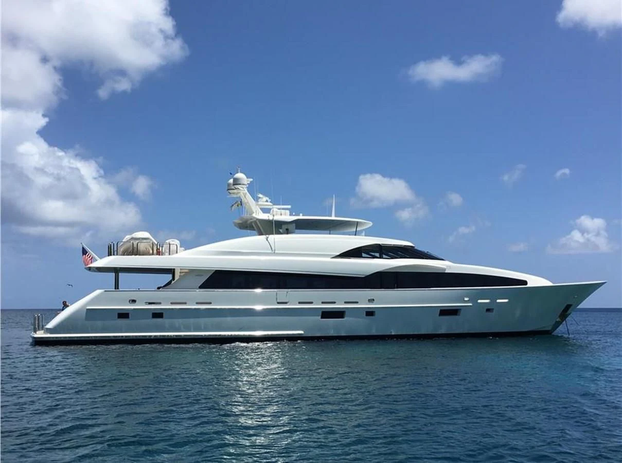 a white yacht on the water aboard FUGITIVE *NAME RESERVED* Yacht for Sale