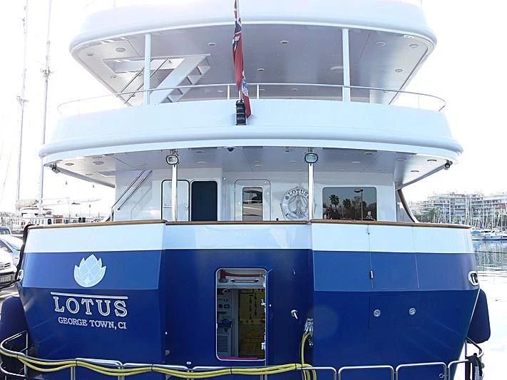 a boat with a flag on the deck aboard LOTUS Yacht for Sale