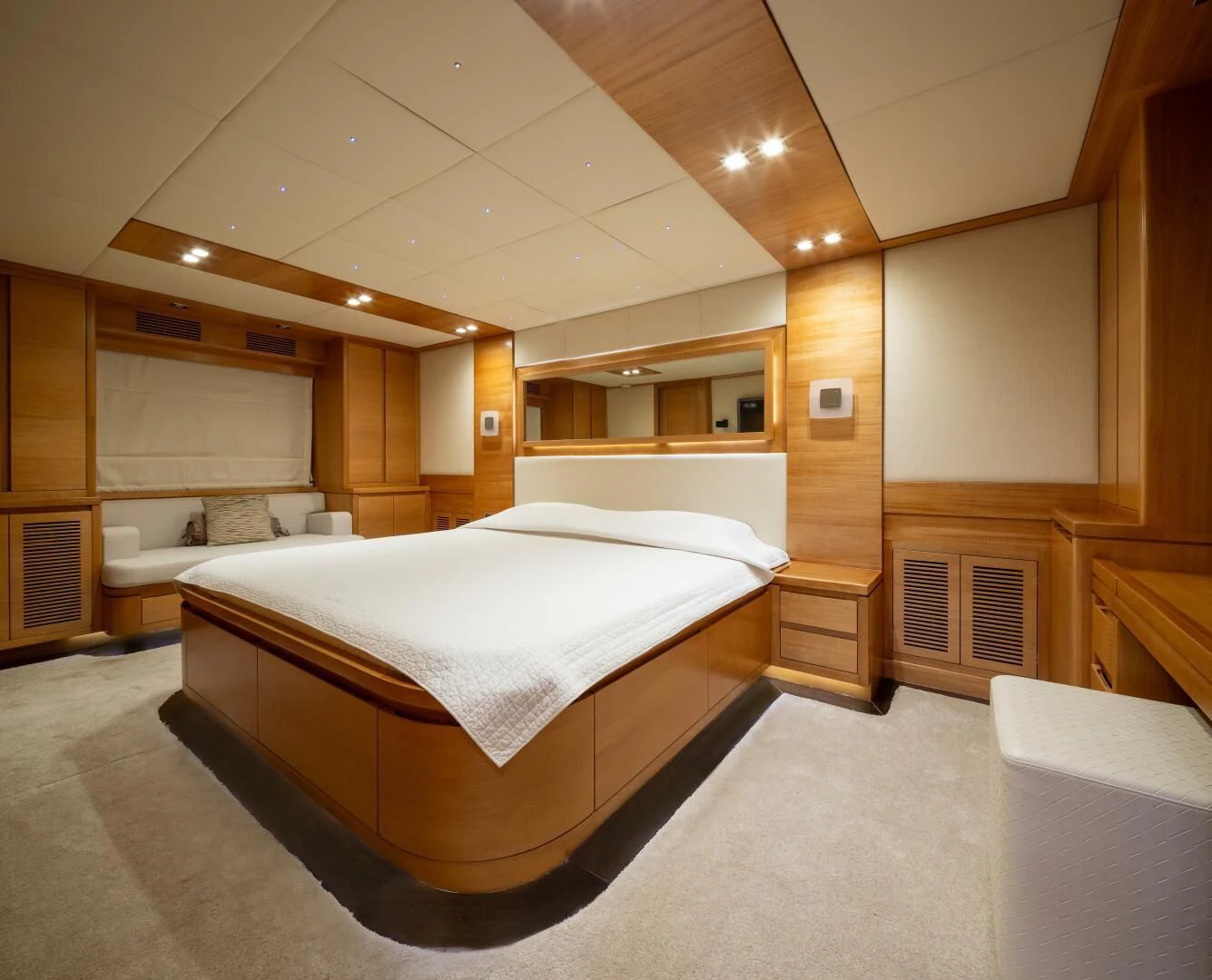 a room with a bed and a mirror aboard ANTALYA Yacht for Sale