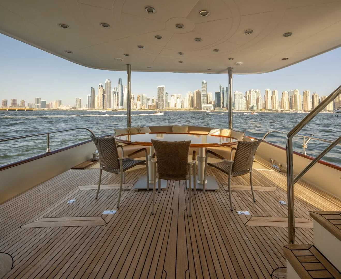 a deck with a view of a city and water aboard ANTALYA Yacht for Sale