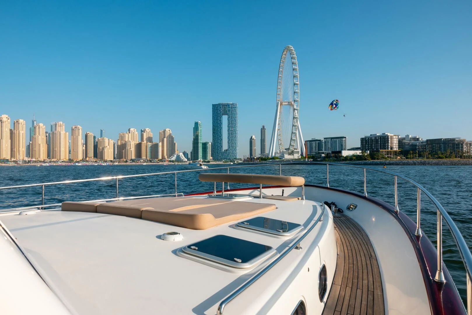a boat on a body of water with a city in the background aboard ANTALYA Yacht for Sale