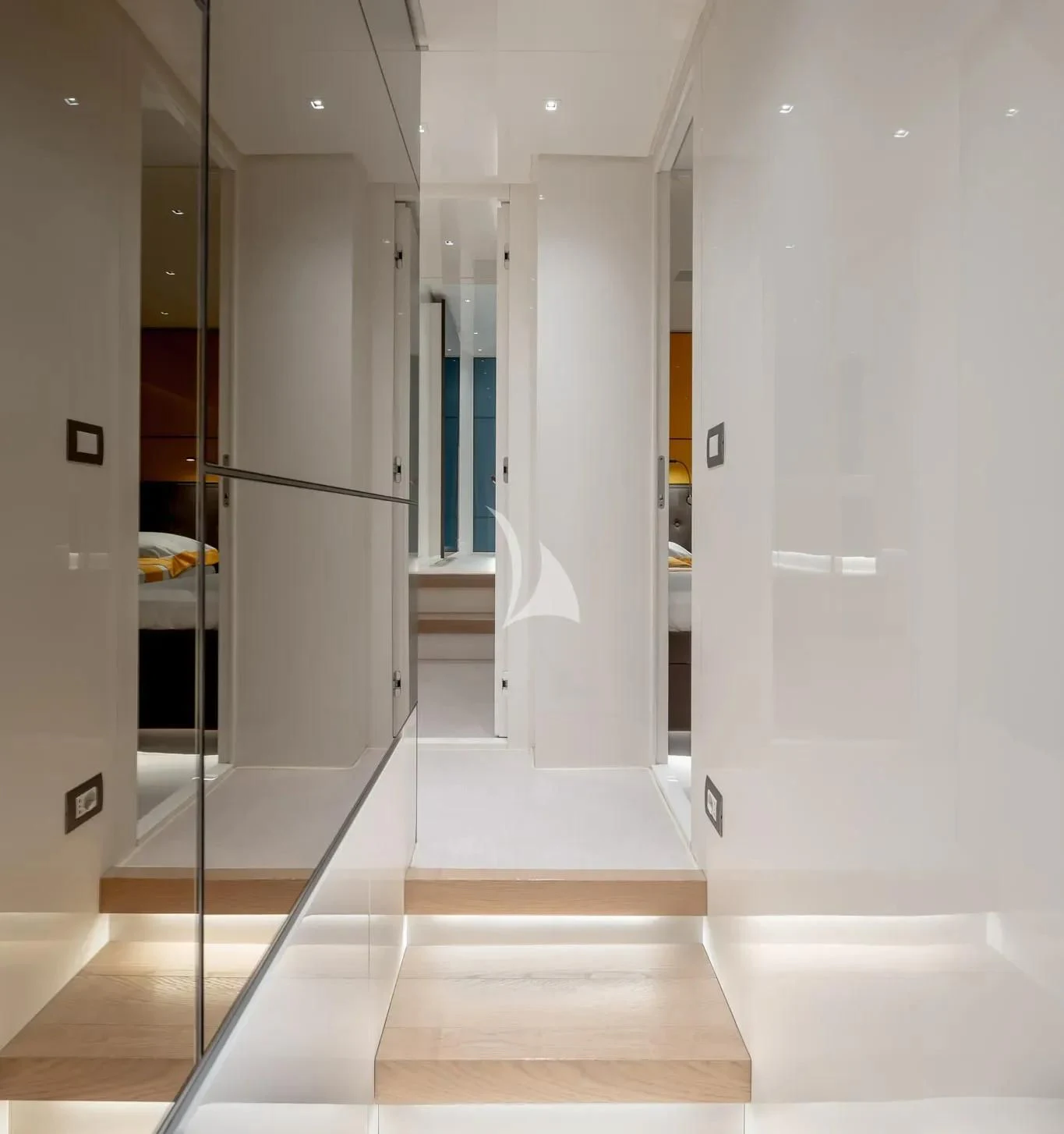 a room with a row of white doors aboard PEMBE Yacht for Charter