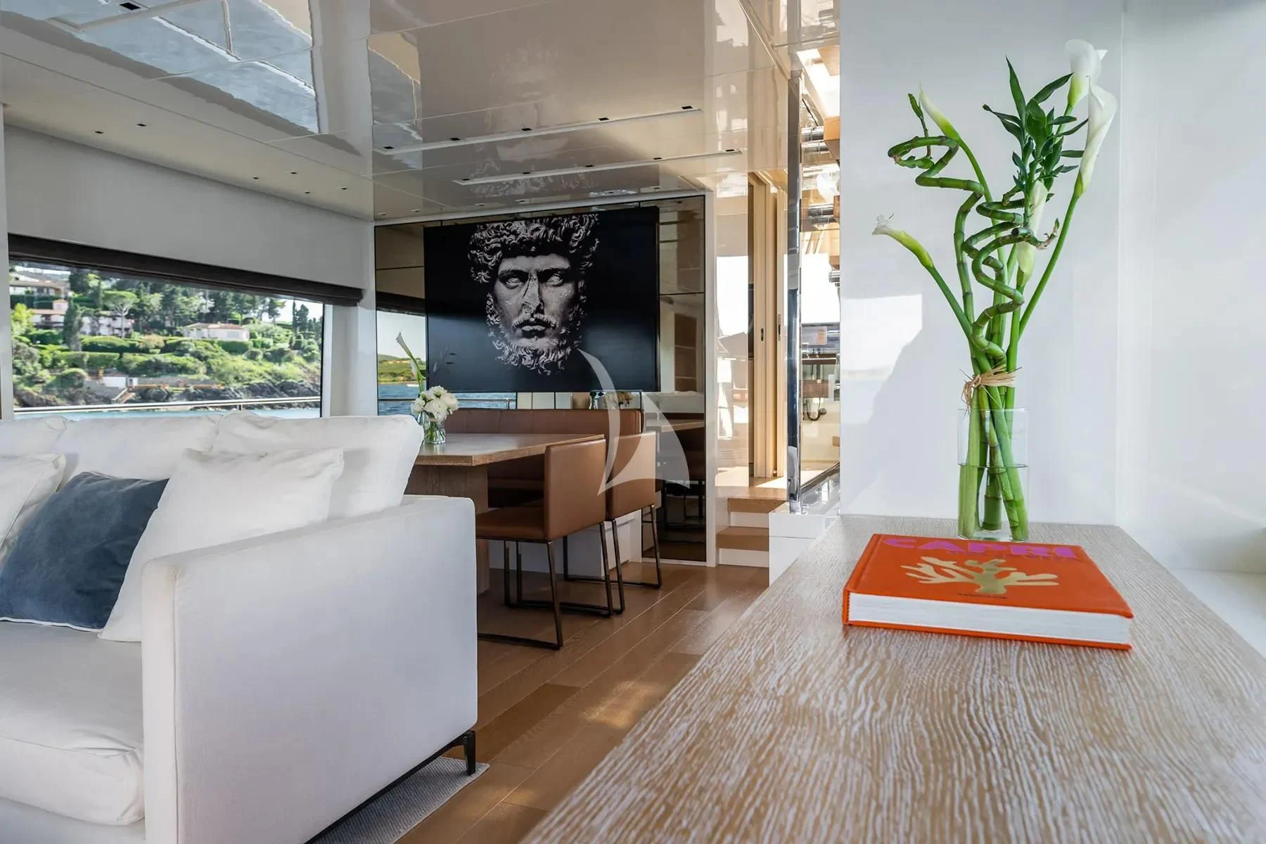 a living room with a table and couches aboard PEMBE Yacht for Charter