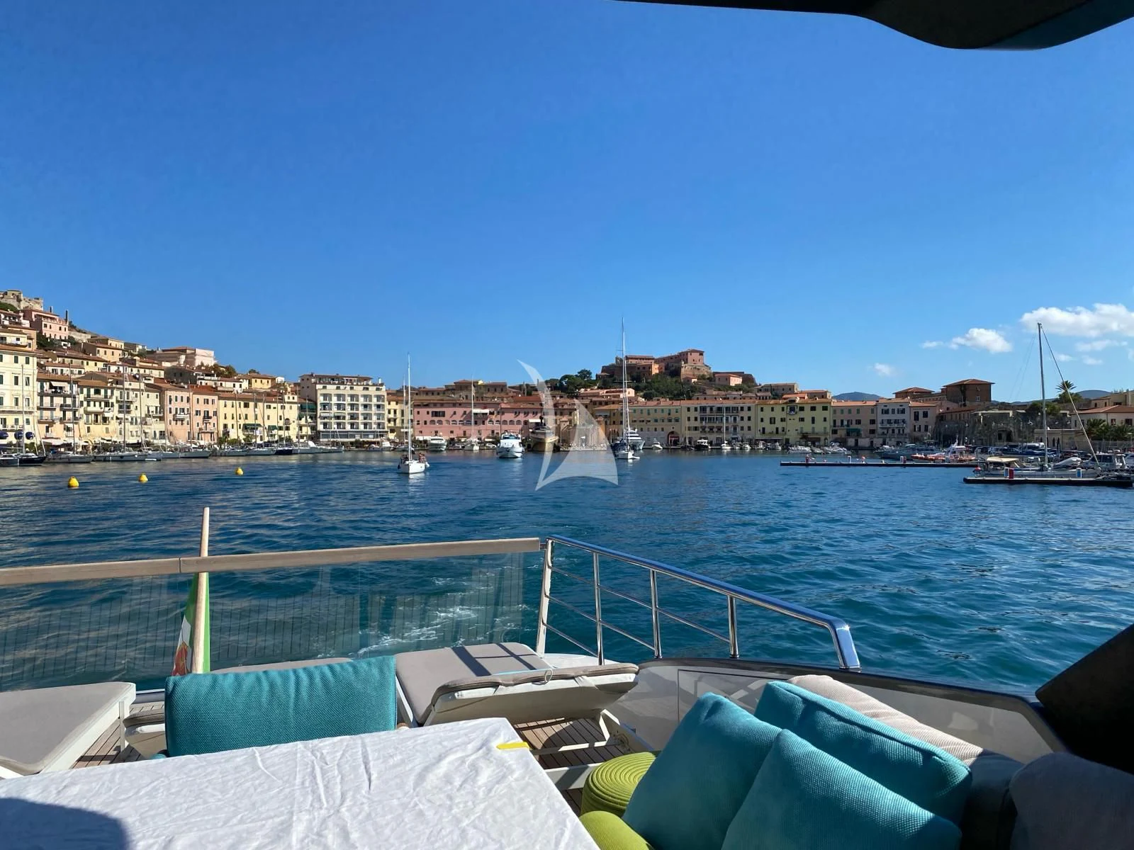 a body of water with boats and buildings on the side aboard PEMBE Yacht for Charter