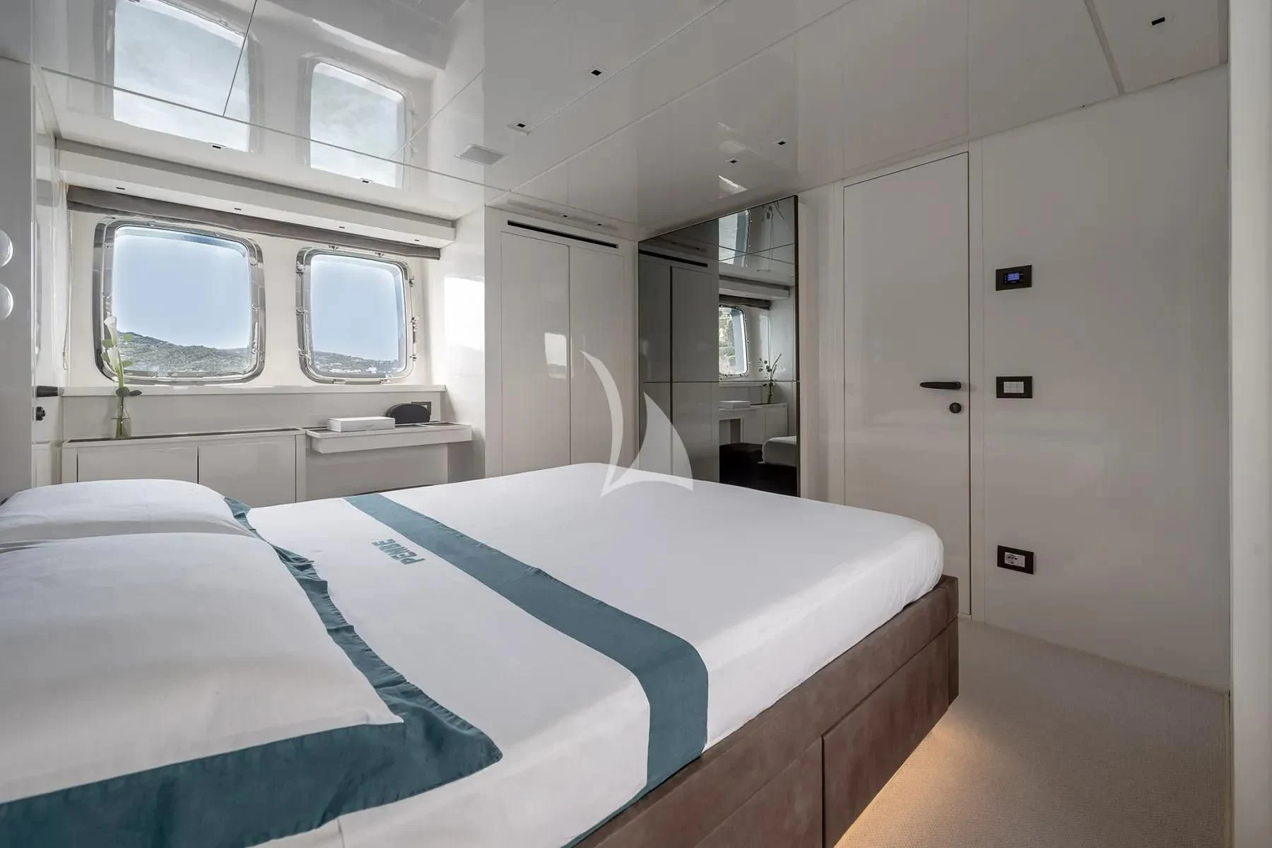 a room with a bed and a window aboard PEMBE Yacht for Charter