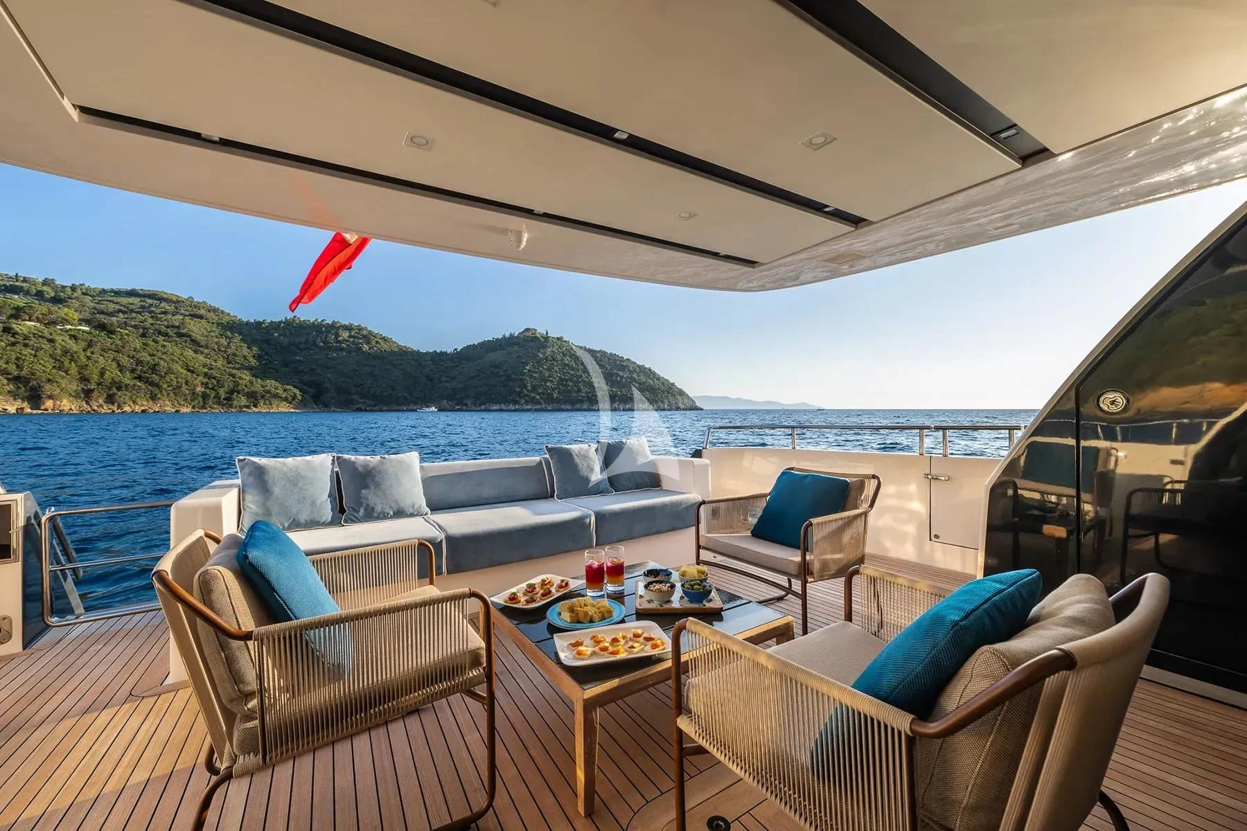 a table and chairs on a boat aboard PEMBE Yacht for Charter