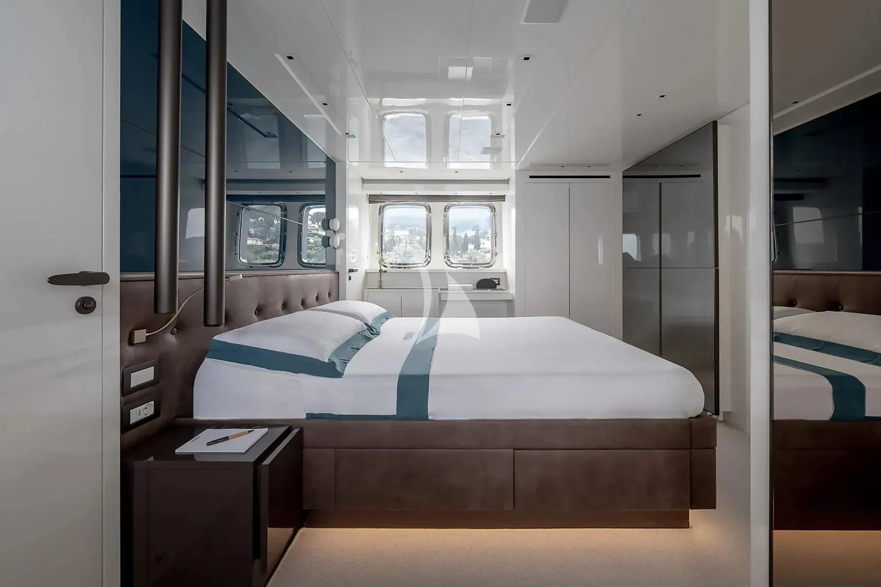 a bed in a room aboard PEMBE Yacht for Charter