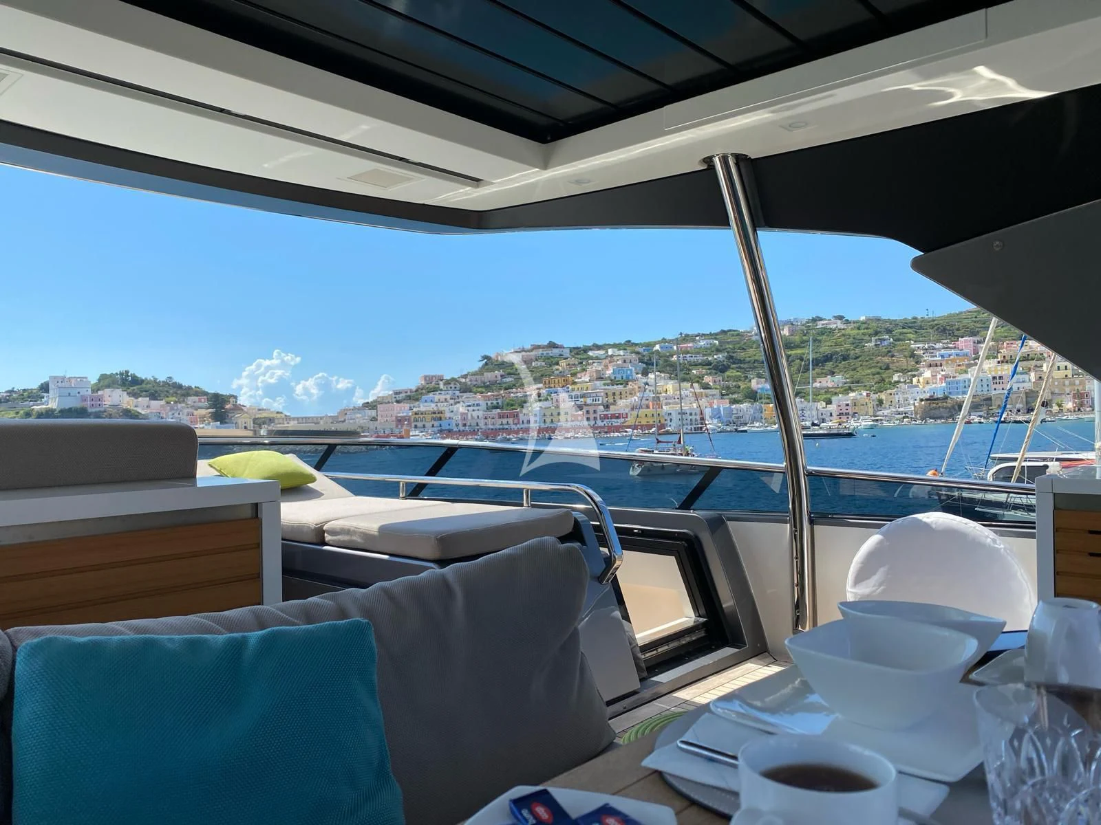 a view of a city from a restaurant aboard PEMBE Yacht for Charter