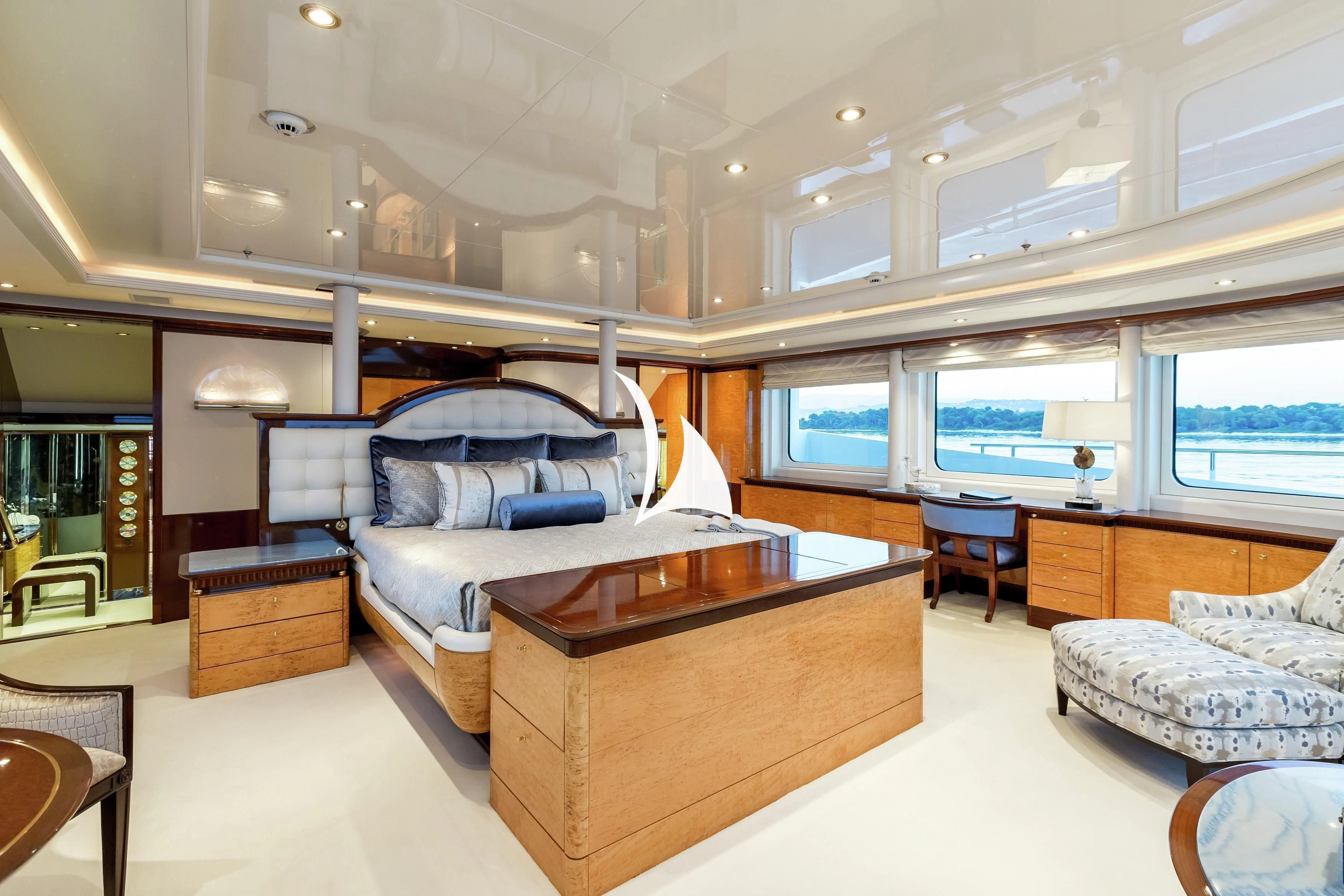 a room with a bed and a desk aboard LUCKY LADY Yacht for Sale