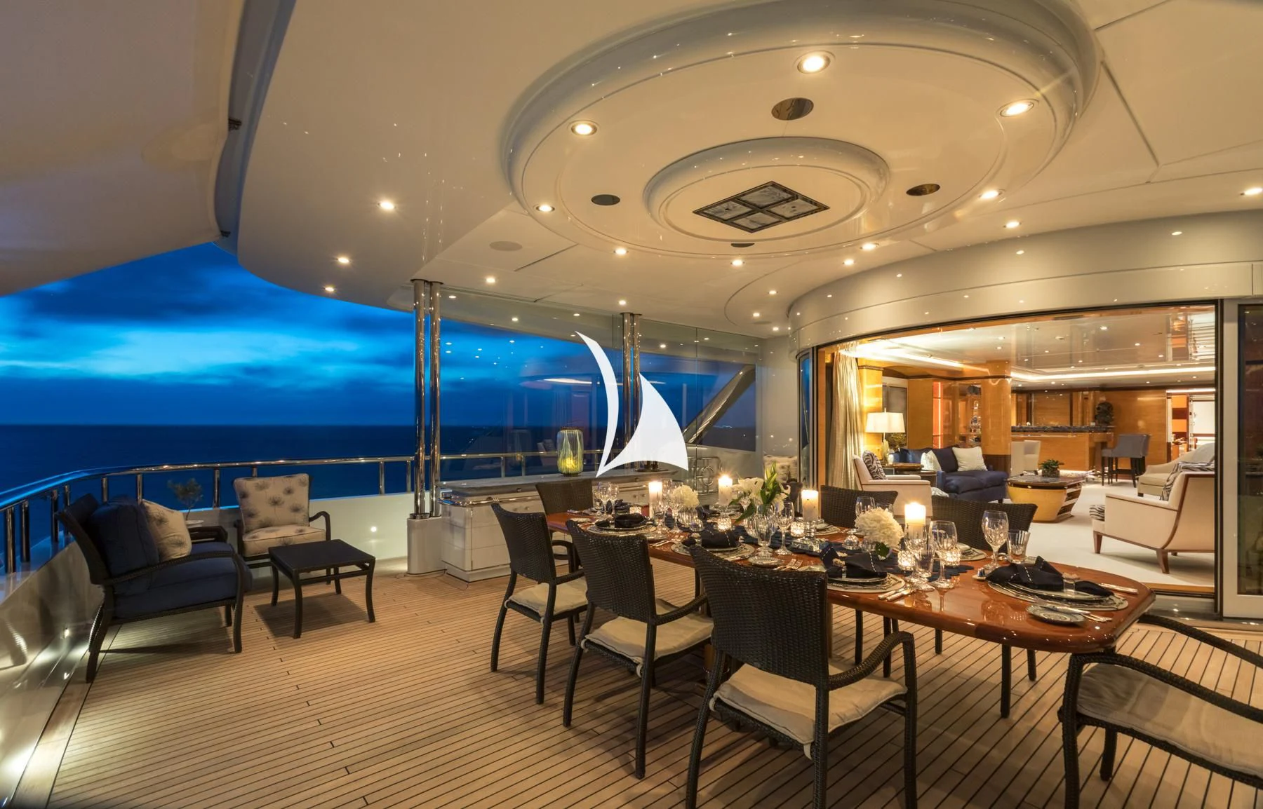 a large room with a table and chairs and a large window aboard LUCKY LADY Yacht for Sale