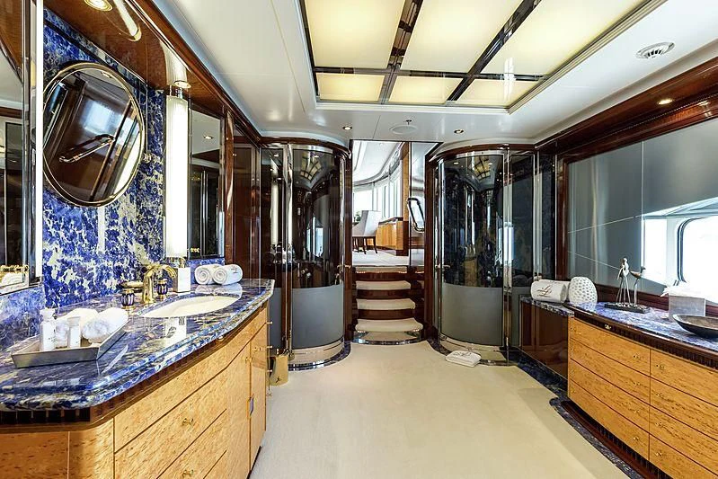 a room with a large mirror and a large sink aboard LUCKY LADY Yacht for Sale