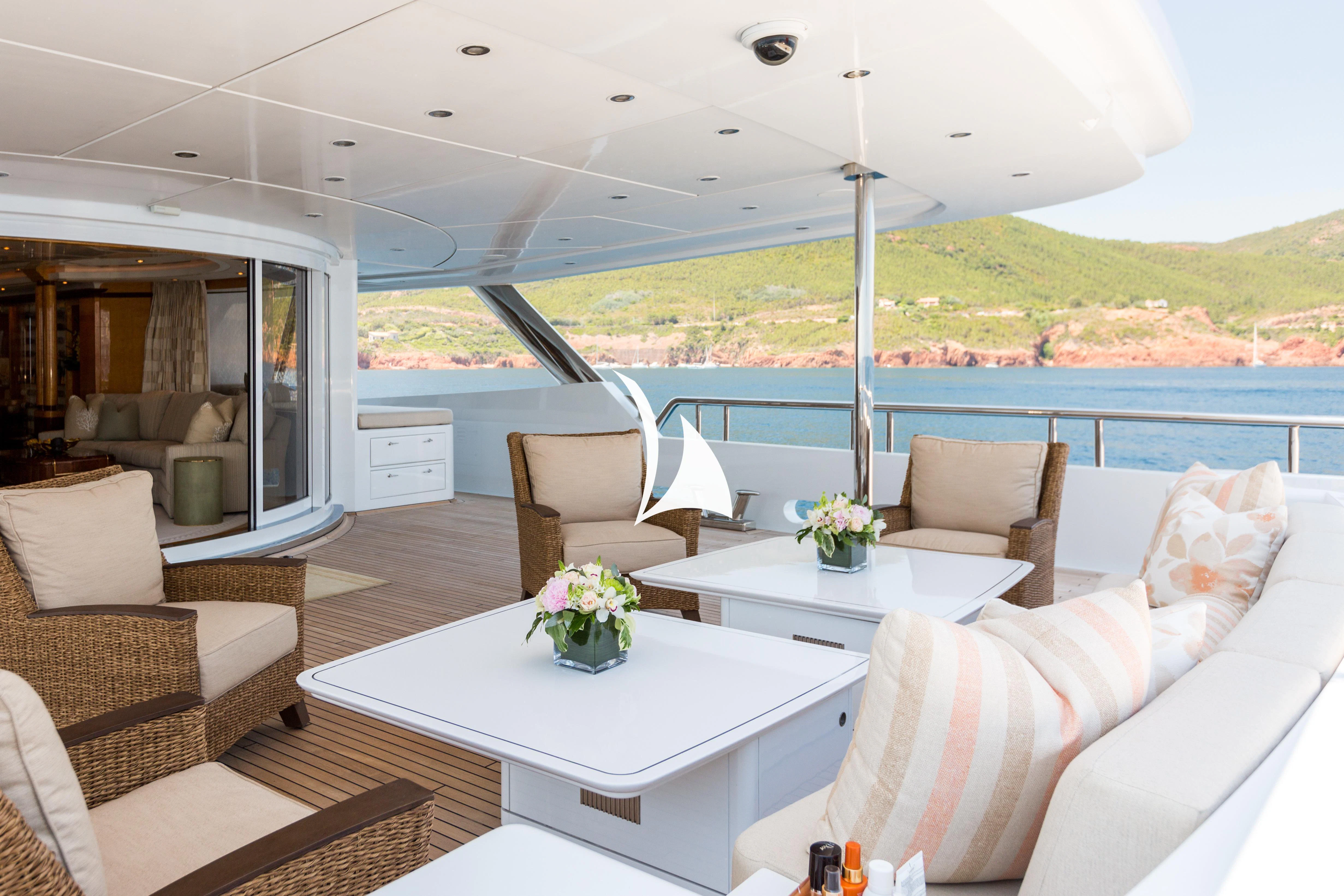 a living room with a large balcony aboard LUCKY LADY Yacht for Sale