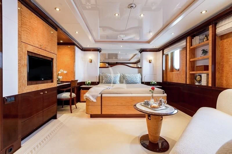 a living room with a bed and a tv aboard LUCKY LADY Yacht for Sale