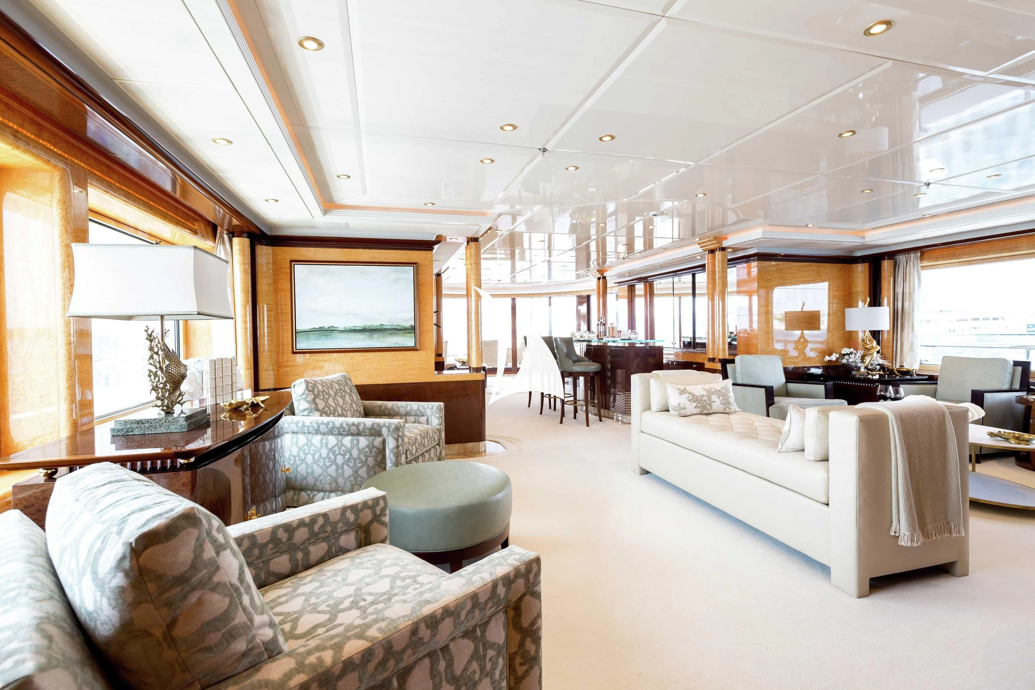 a living room with a couch and a table aboard LUCKY LADY Yacht for Sale