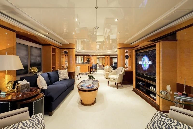 a living room with a large television aboard LUCKY LADY Yacht for Sale
