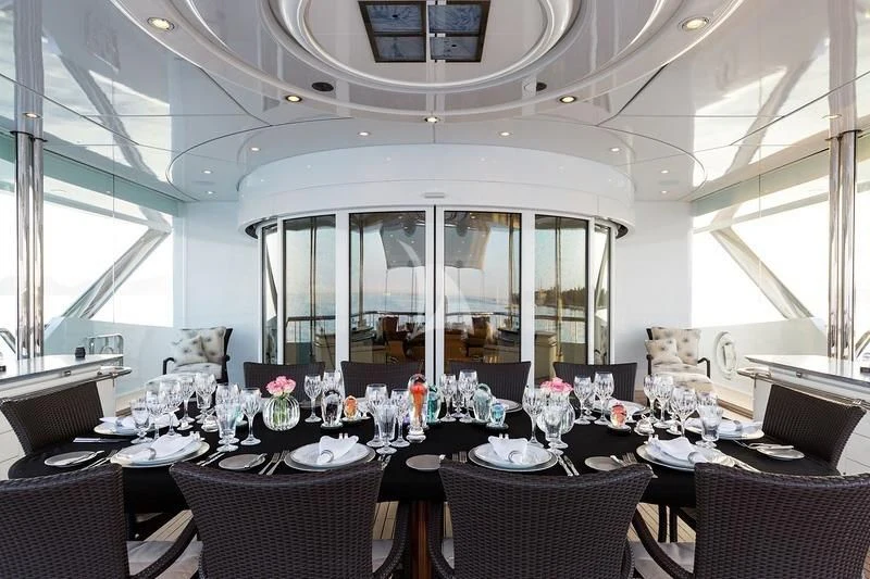 a dining room with a large table and chairs aboard LUCKY LADY Yacht for Sale