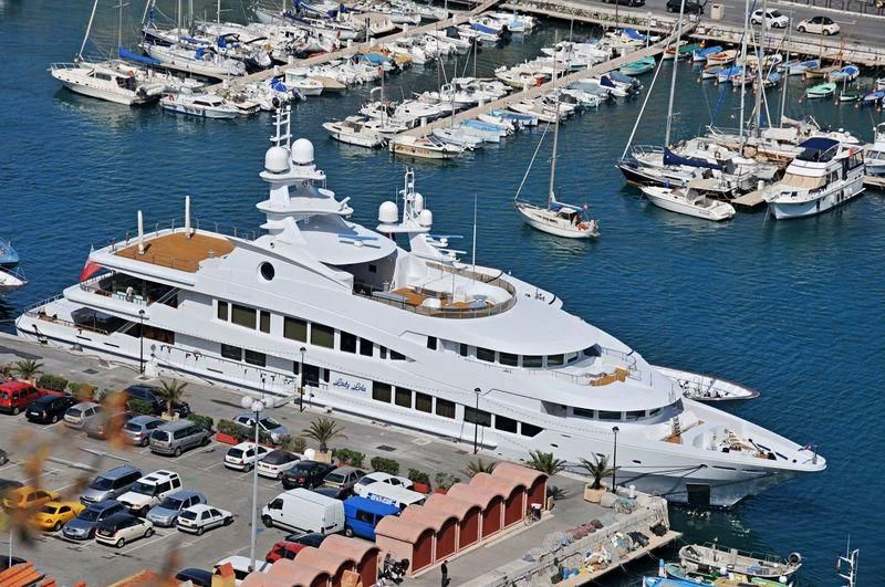a large cruise ship docked at a port aboard LUCKY LADY Yacht for Sale