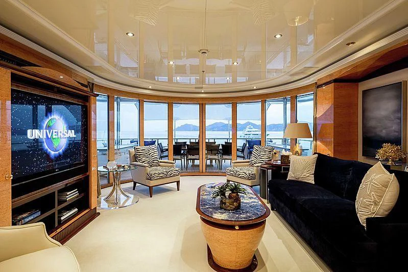 a living room with a large screen aboard LUCKY LADY Yacht for Sale