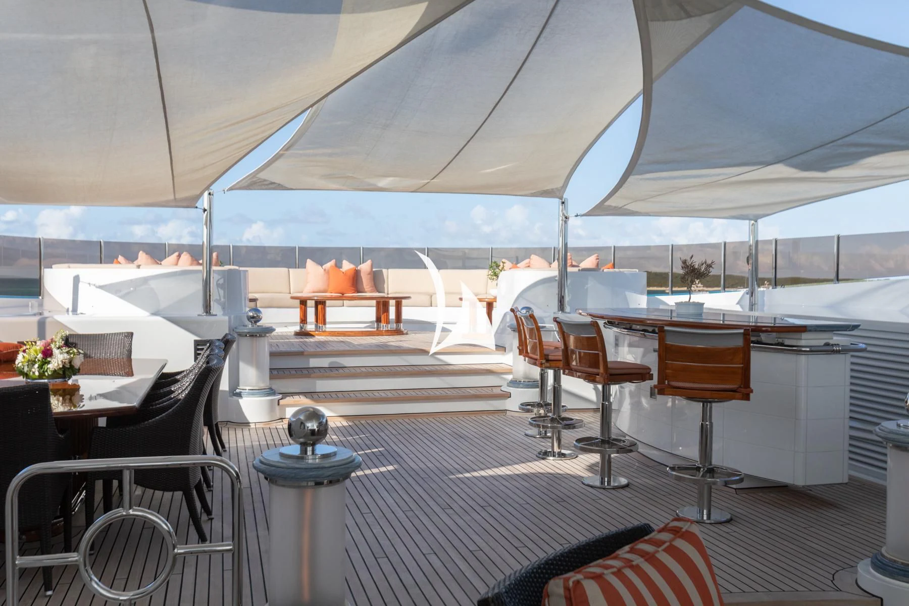a room with a table and chairs aboard LUCKY LADY Yacht for Sale