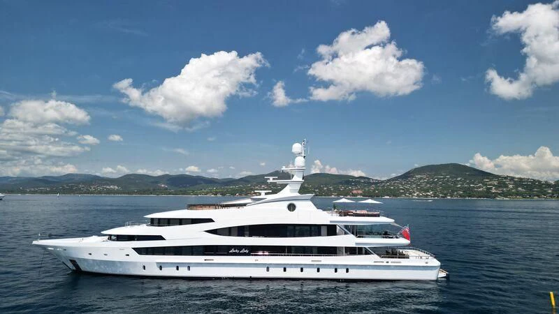 a white yacht in the water aboard LUCKY LADY Yacht for Sale