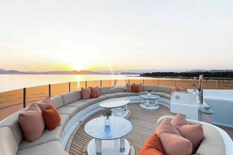 a living room with a large balcony aboard LUCKY LADY Yacht for Sale
