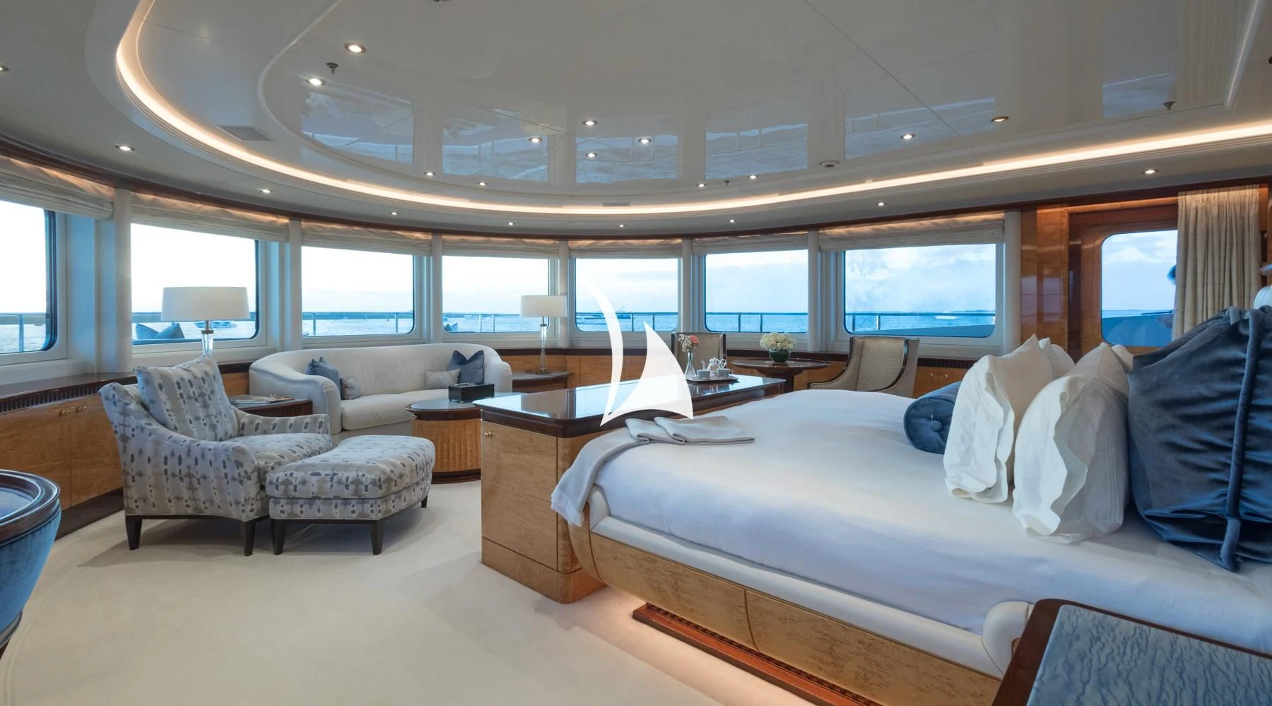 a room with a bed and a desk aboard LUCKY LADY Yacht for Sale