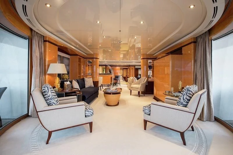 a large living room with a large mirror aboard LUCKY LADY Yacht for Sale